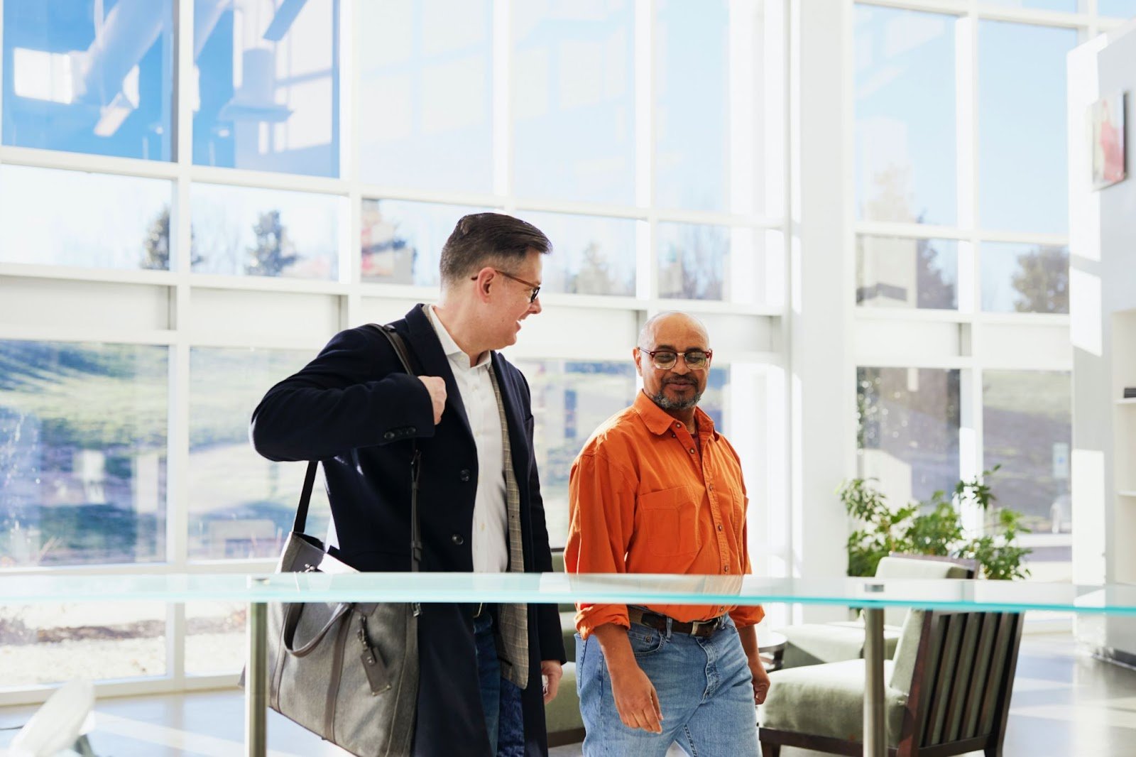 two-men-walking-into-office-building-setting-boundaries