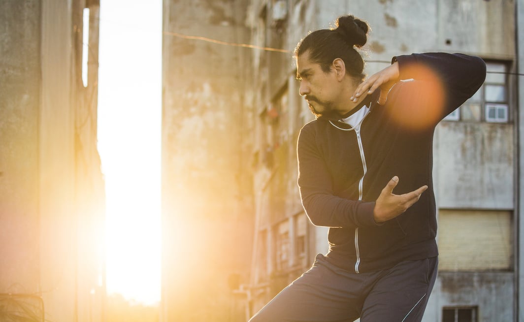 man-backlit-by-sun-practices-movement-how-to-do-inner-work