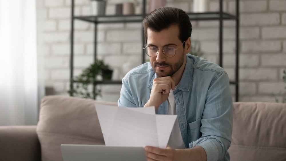 Male-holding-piece-of-paper-thinking-concentration-exercises