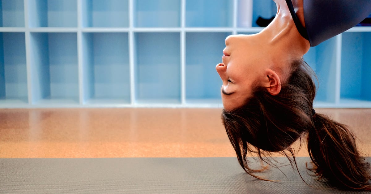 woman hanging upside down - mentally fit