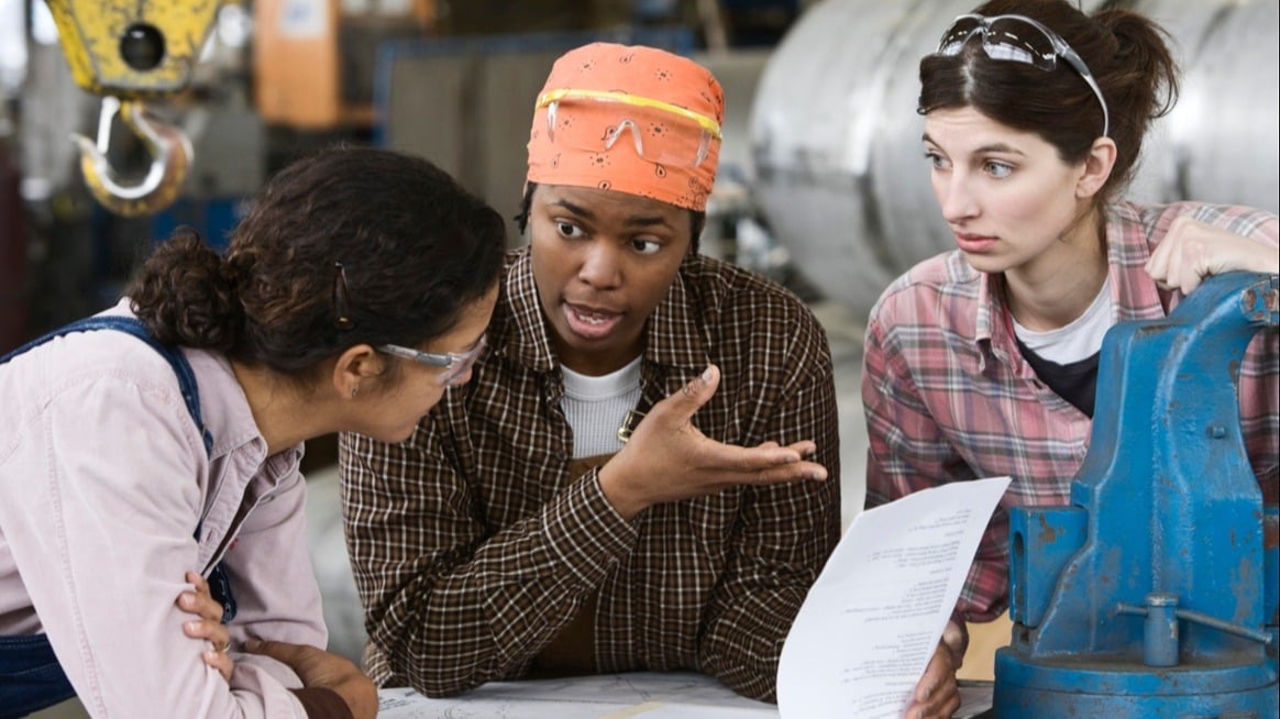 three-workers-problem-solve-in-factory-mental-health-impedes-creativity